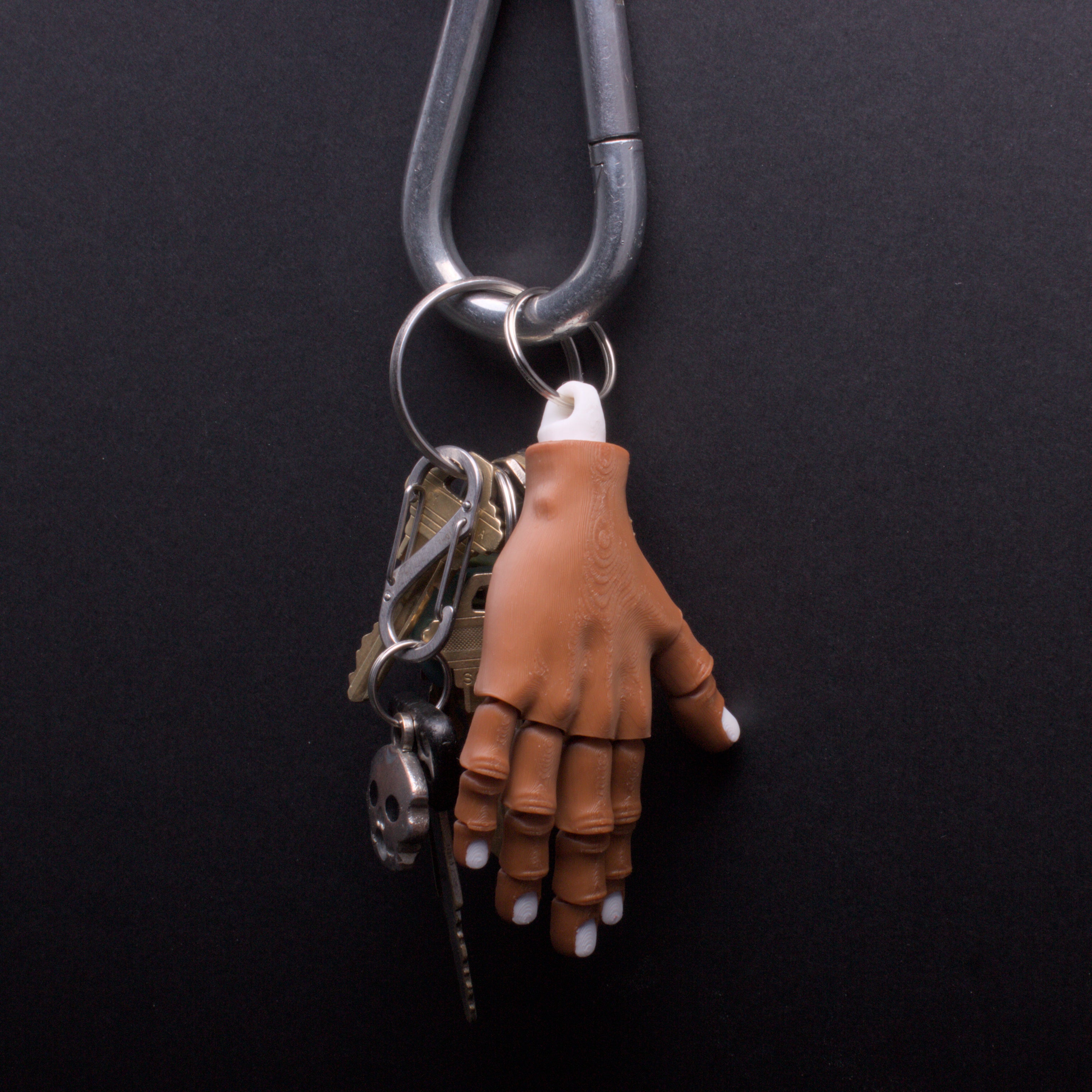 Severed hand keychains, zipper-pulls and purse charms